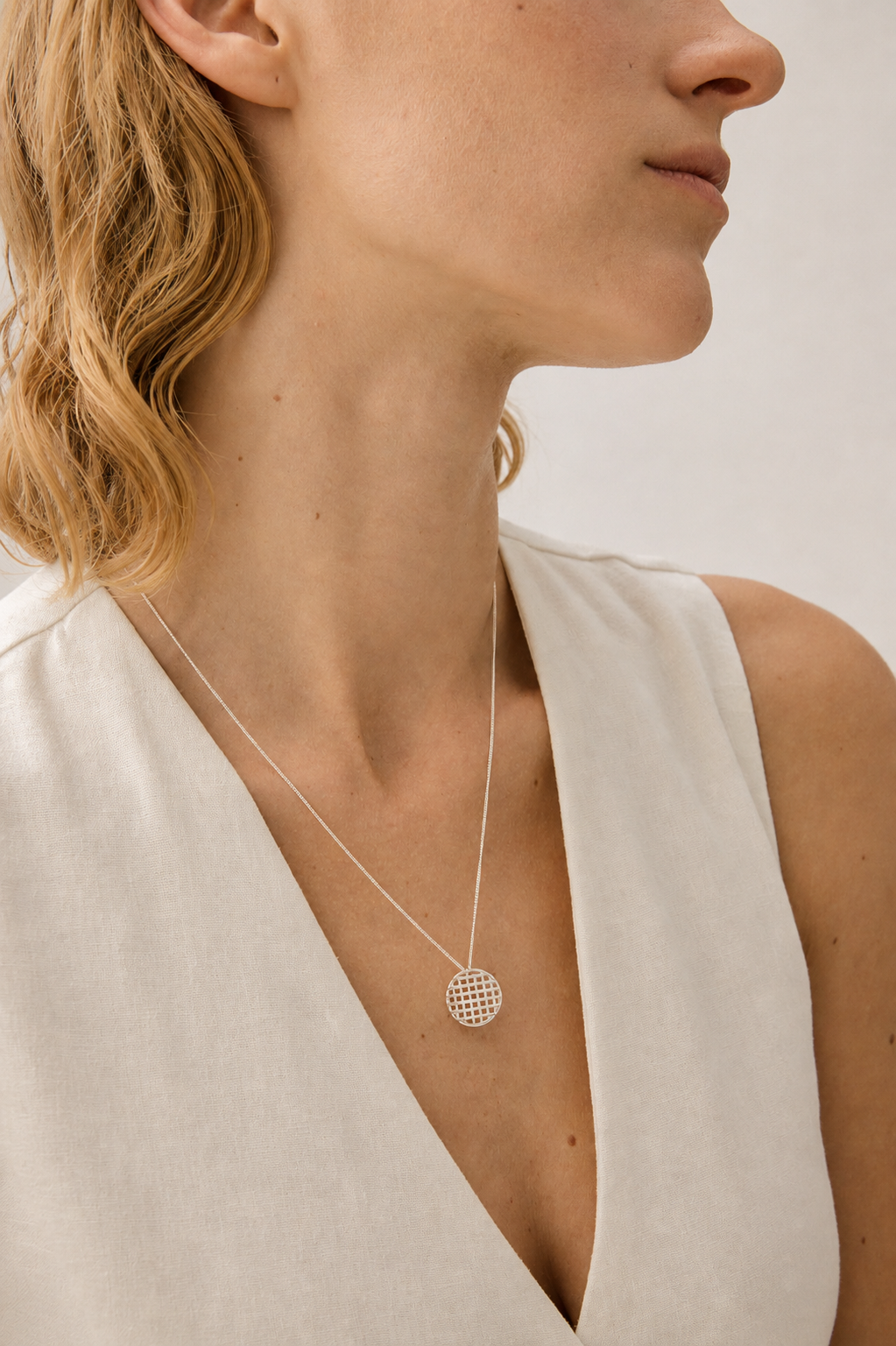 Silver Lattice Necklace worn around the neck