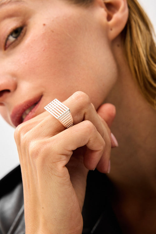 Close-up of the silver Interspace Ring geometric structure