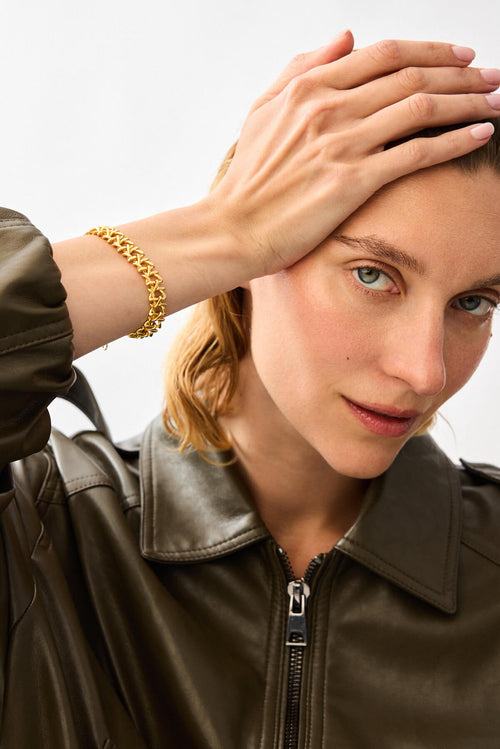 Model wearing the matte gold SOD Bracelet, Star Of David Motif Bracelet